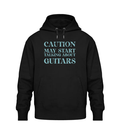 Schwarzer Oversize Hoodie Unisex für Frauen und Männer bedruckt mit dem Design der Roger Rockawoo Kollektion Caution may start talking about guitars